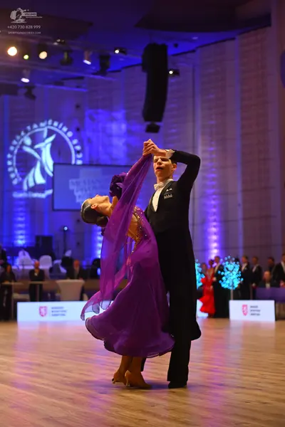 Dancesport competitor: Male dancer: black formal dance suit with a white shirt