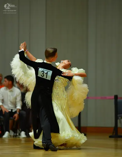Dancesport competitor: Male dancer: black long-sleeved shirt and black trousers