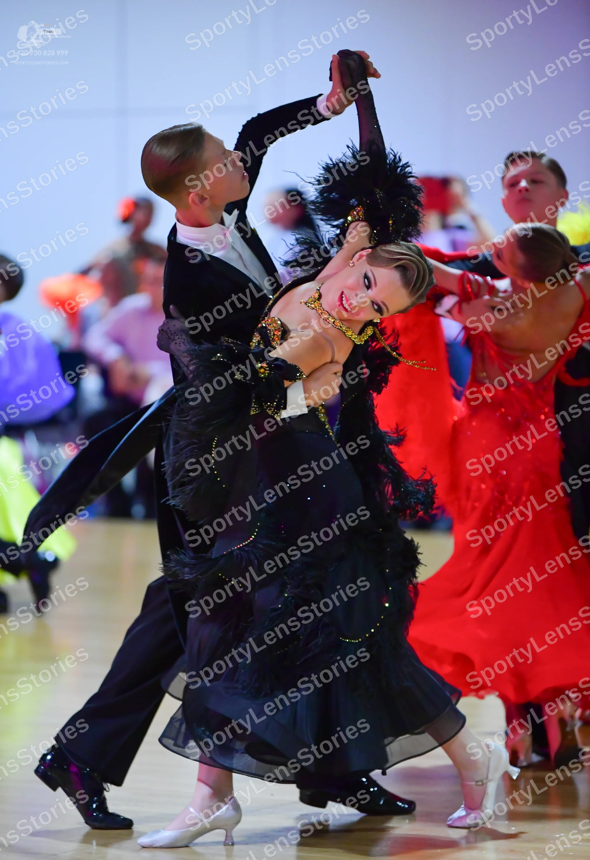 Dancesport competitor: Male dancer: black suit with white shirt and black trousers