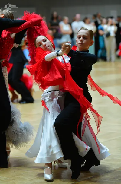 Dancesport competitor: Male dancer: black long-sleeved shirt and black trousers