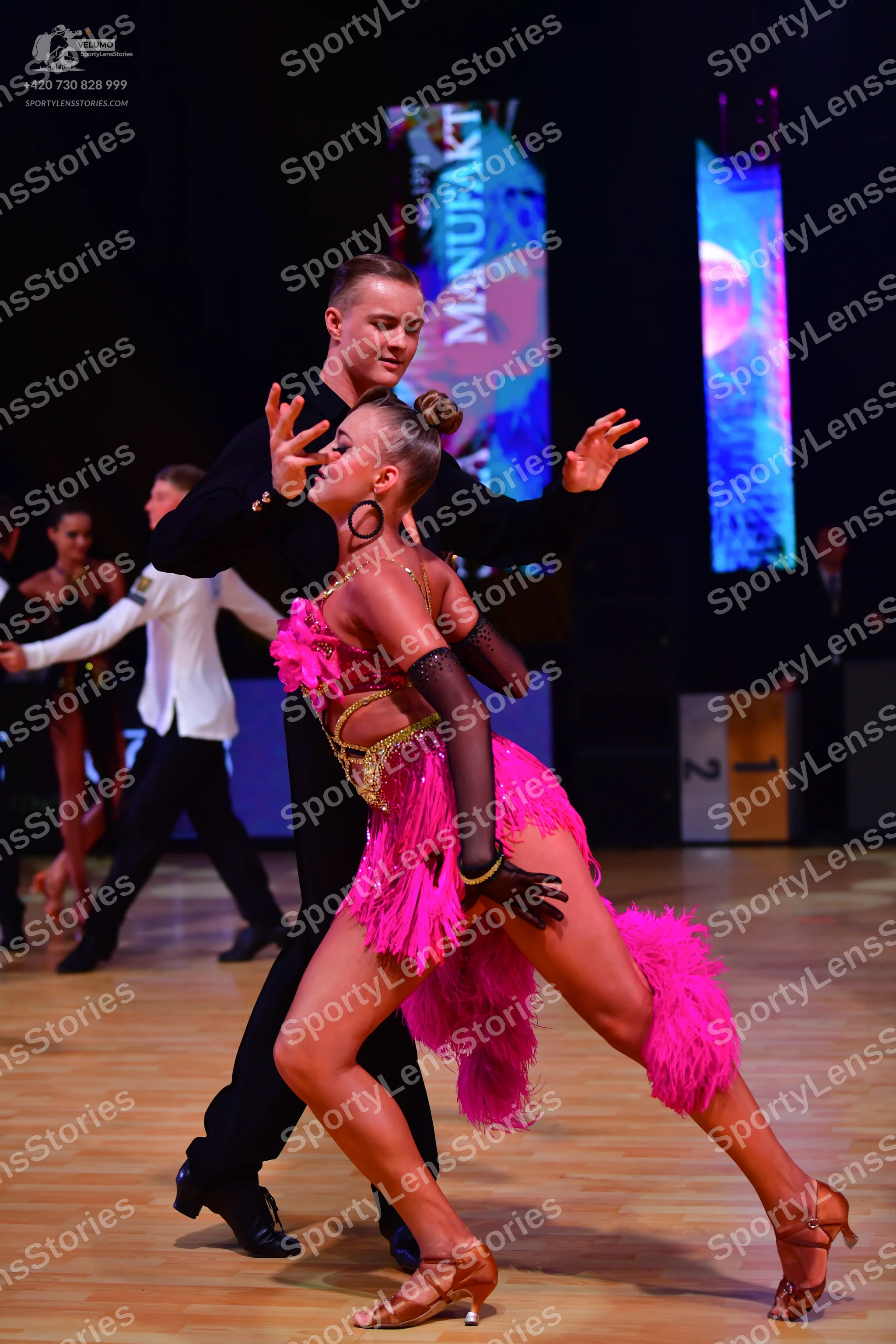 Dancesport competitor: Main male dancer: black long-sleeved shirt and black trousers