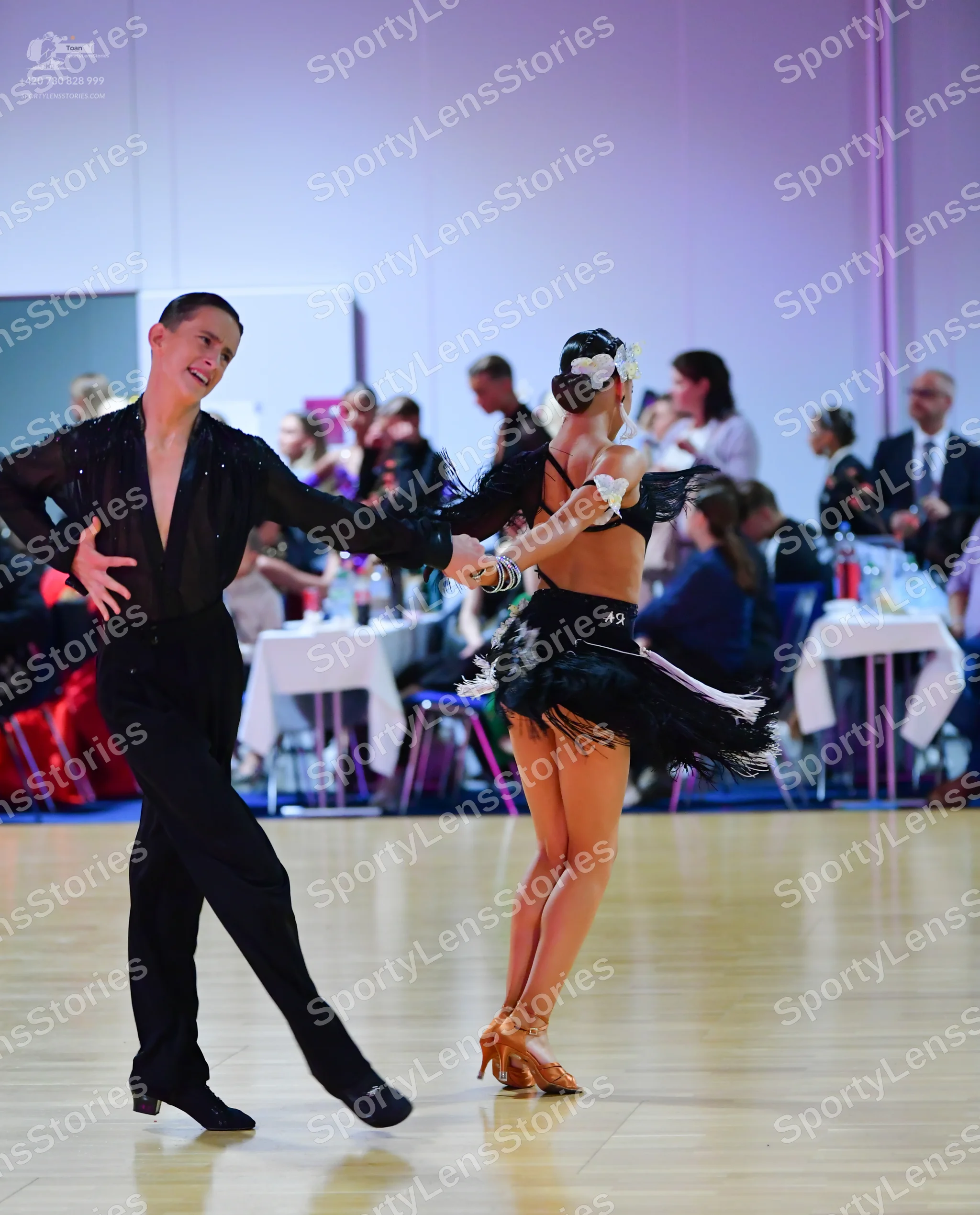 Dancesport competitor #12: Male dancer: black long-sleeved shirt with small crystals and black dance trouse