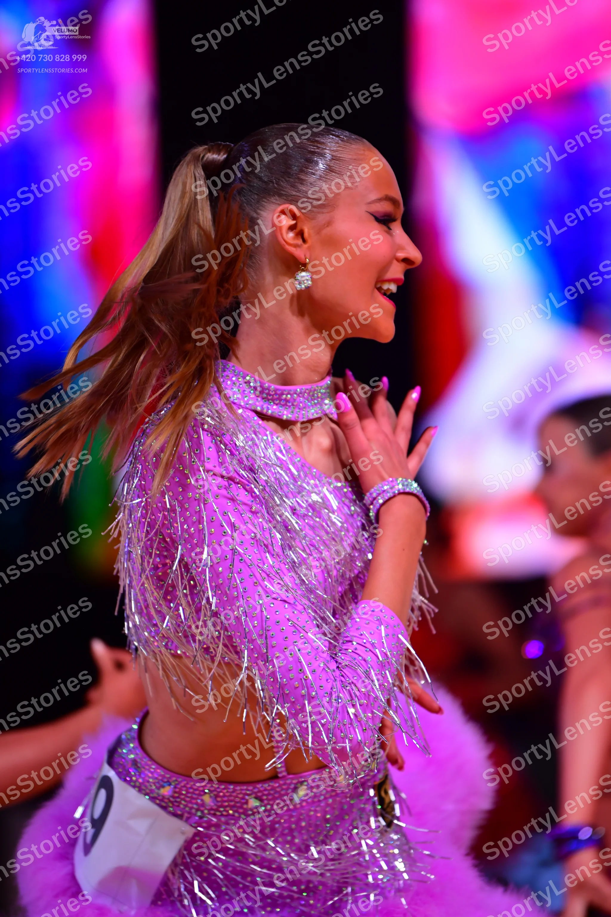 Dancesport competitor: Female dancer: light purple latin dress with silver sequins and long silver frin