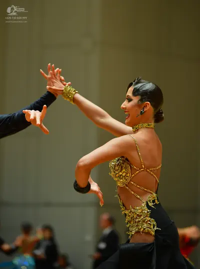 Dancesport competitor: Male dancer: Black long-sleeved shirt or suit jacket