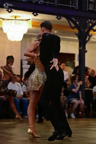 Dancesport competitor: Male dancer: black suit