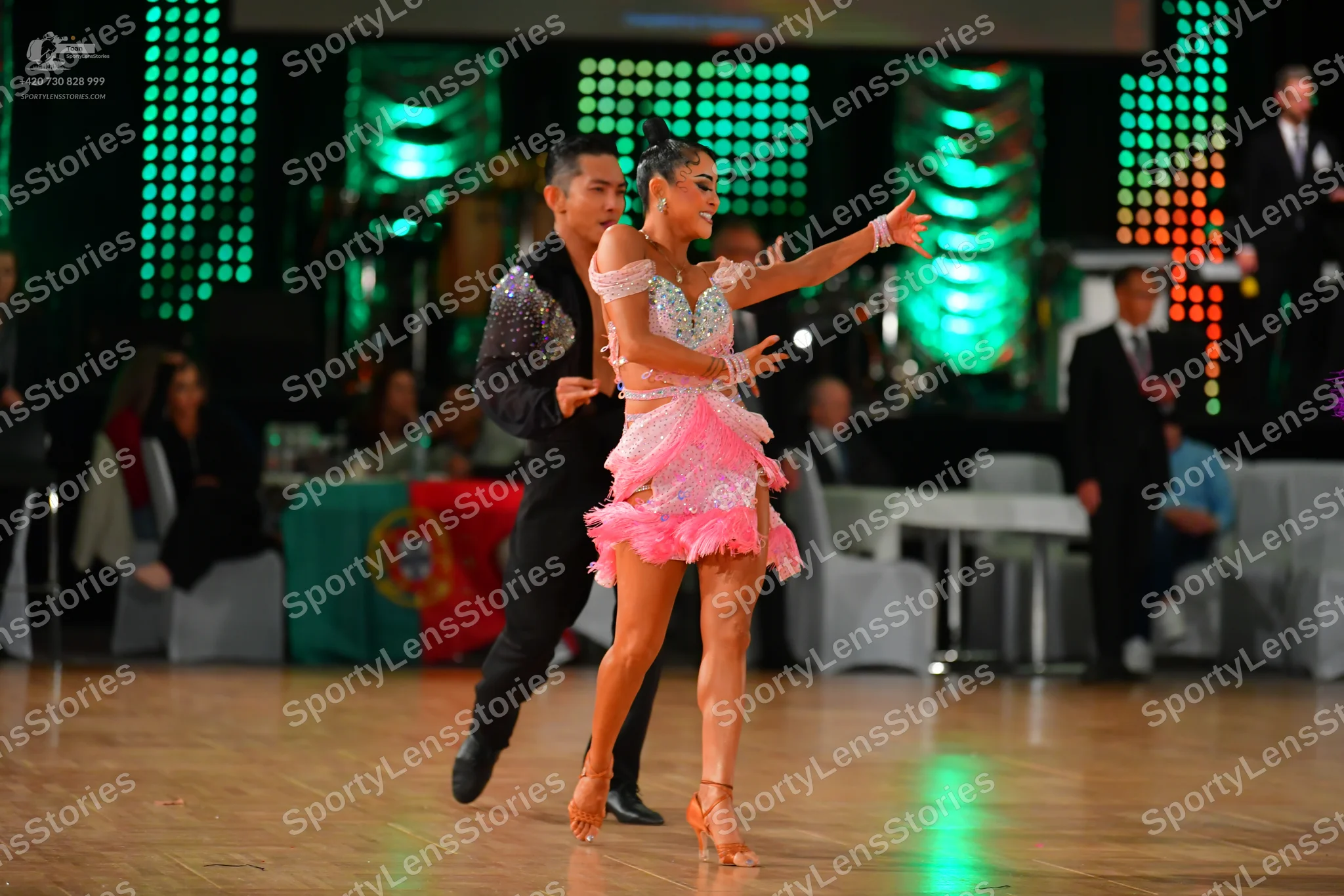 Dancesport competitor: Male dancer: black long-sleeved top with sequins on the shoulders and black trou
