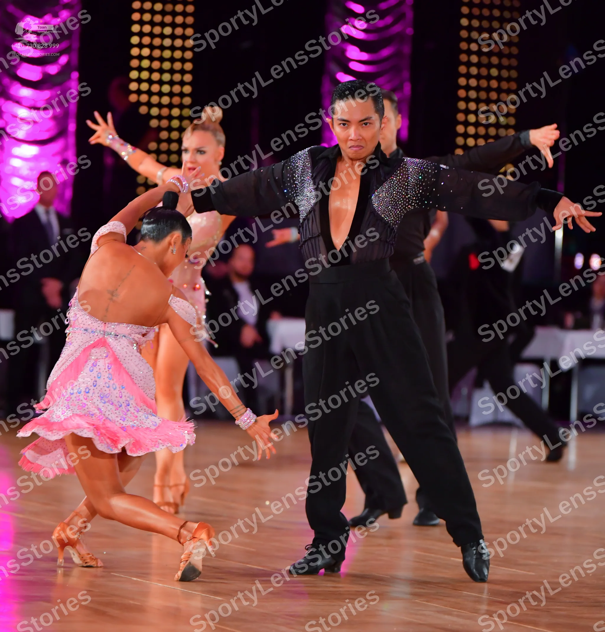 Dancesport competitor: Male dancer: black Latin dance shirt with sequin embellishments on the shoulders