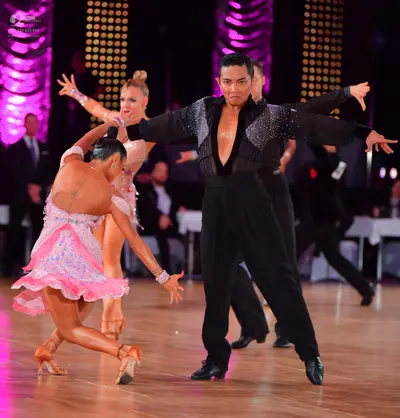 Dancesport competitor: Male dancer: black Latin dance shirt with sequin embellishments on the shoulders