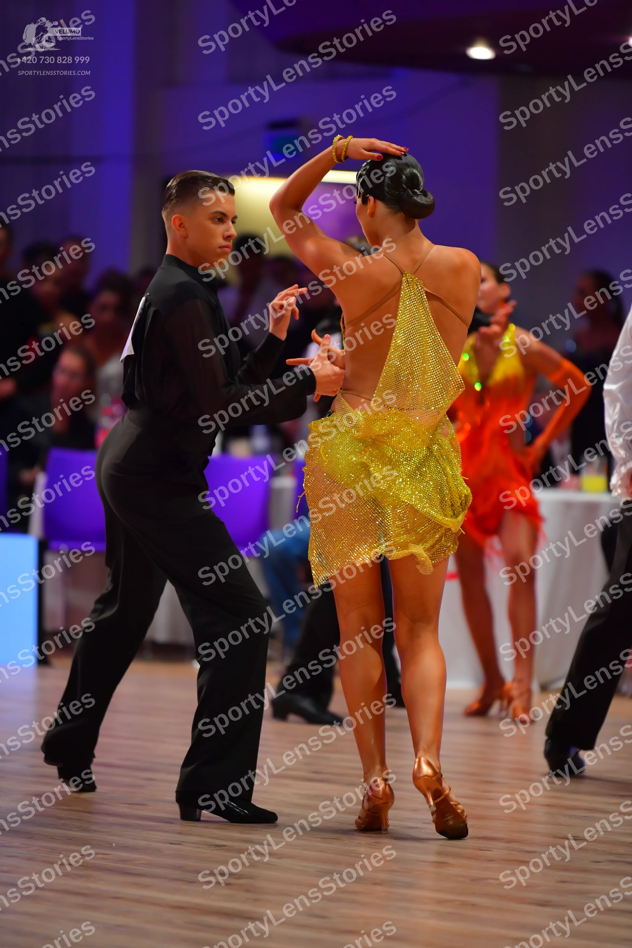 Dancesport competitor: Male dancer: black long-sleeved shirt and black trousers