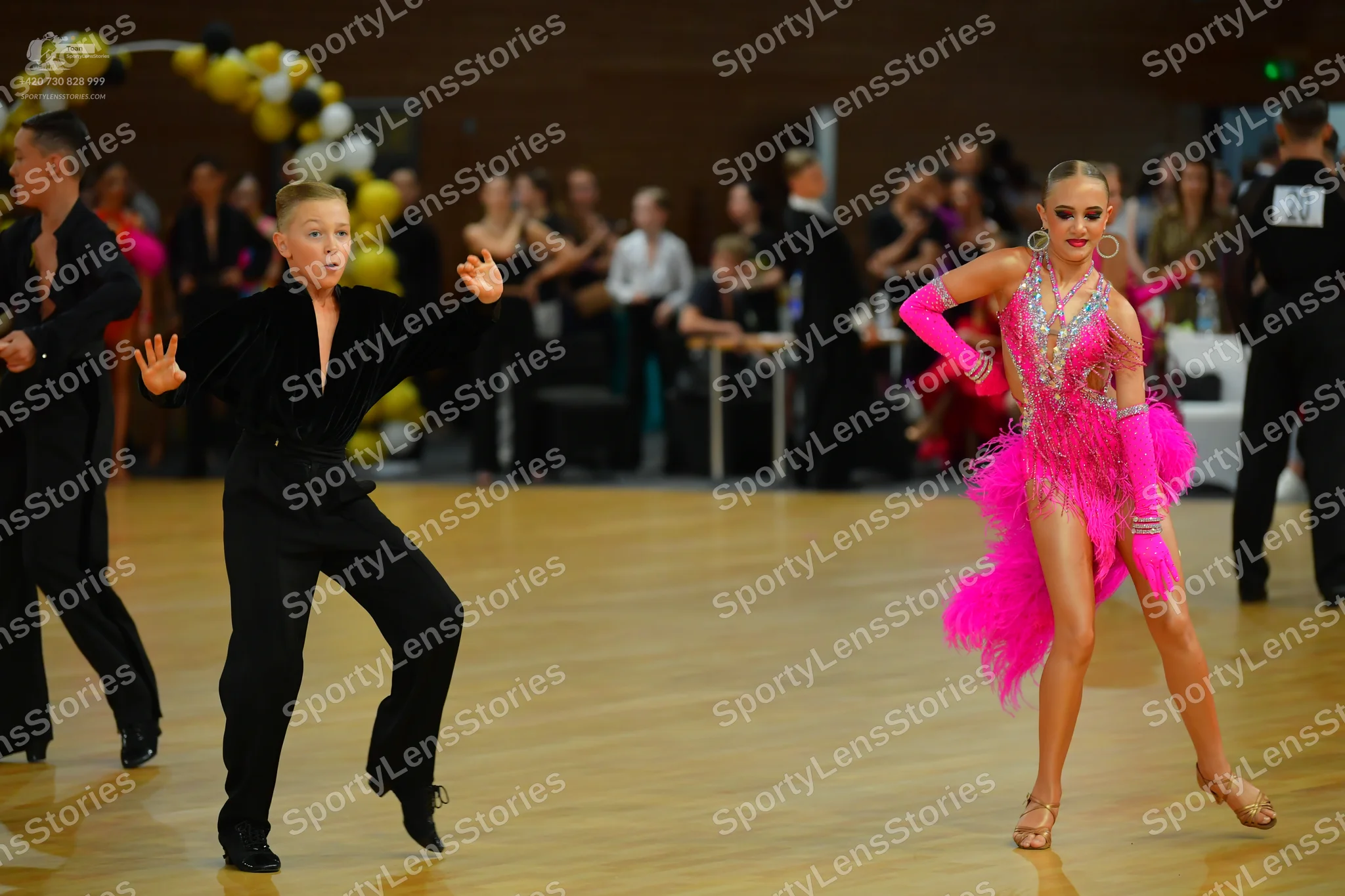 Dancesport competitor: ** Black tail suit with silver sequin lapels