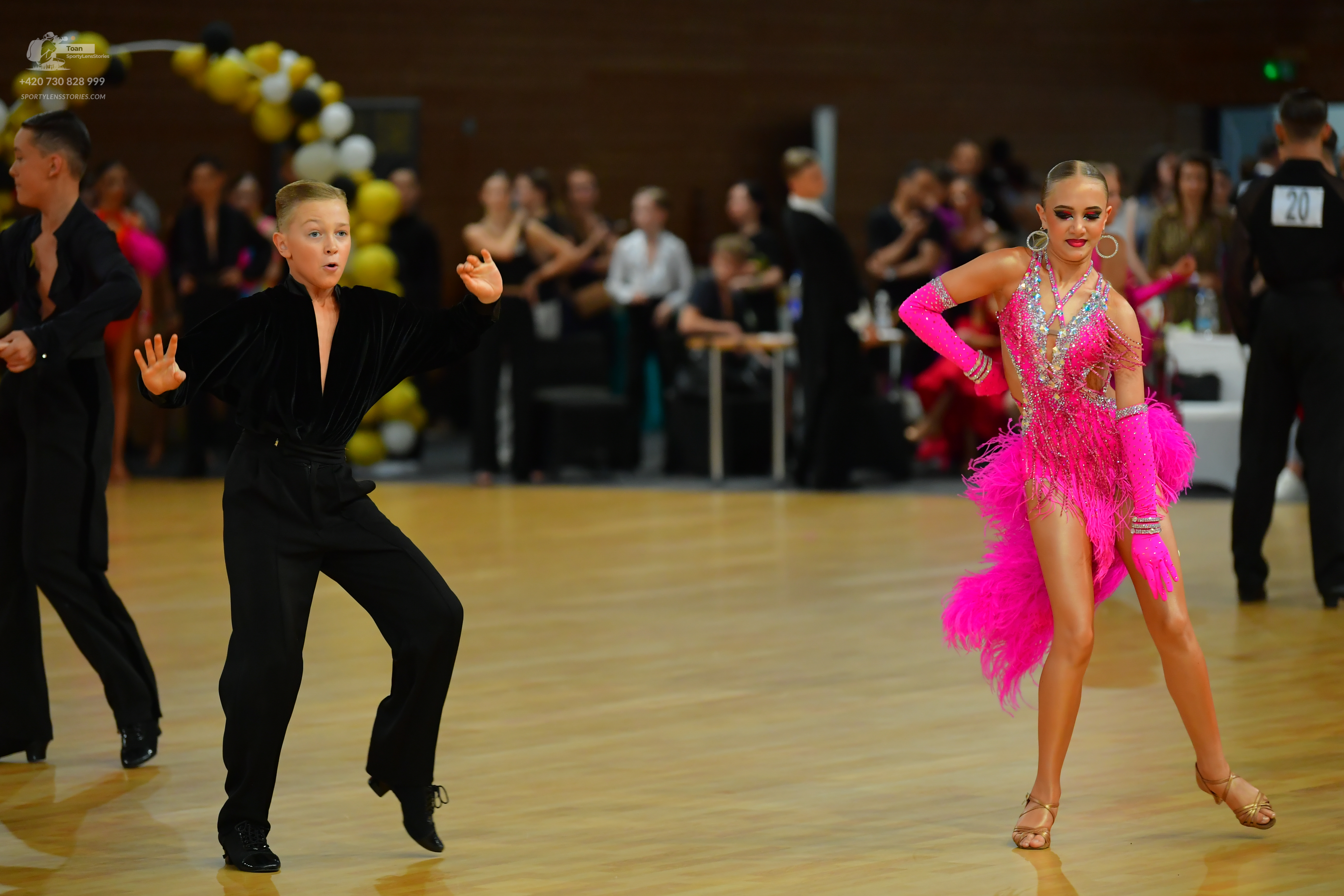 Dancesport competitor: ** Black tail suit with silver sequin lapels