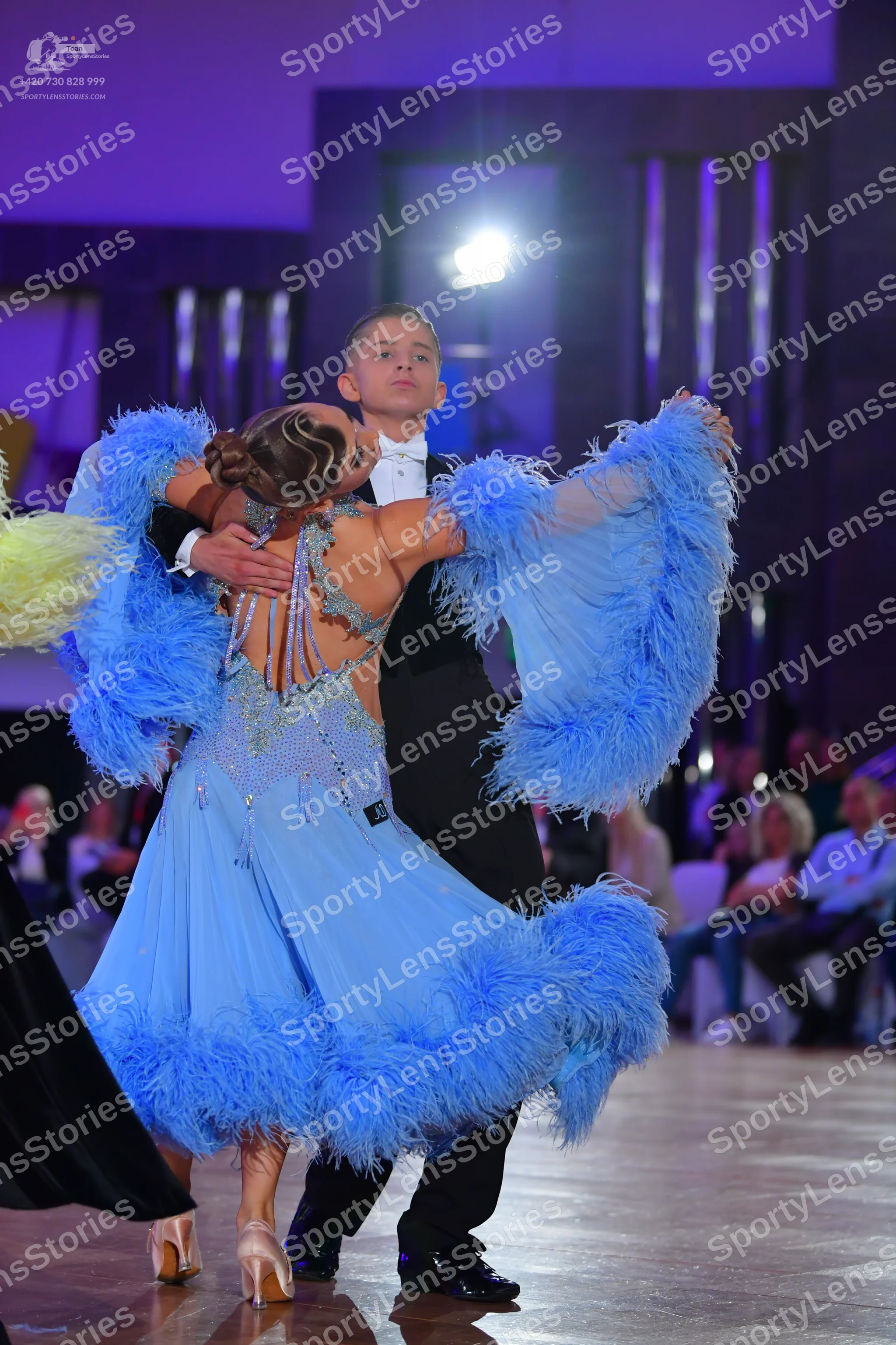 Dancesport competitor: Male dancer: black suit with a white shirt and white bowtie