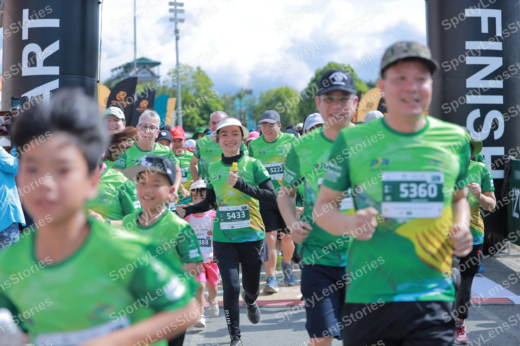 Marathon runner #5433, #5227: Runner 1: green jersey