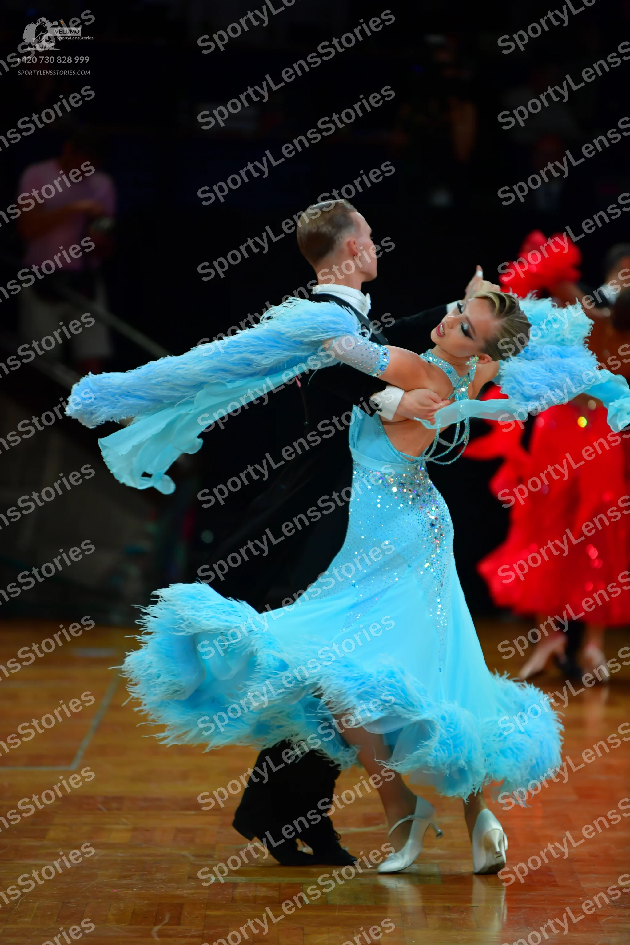 Dancesport competitor: Male dancer: black suit with a white shirt