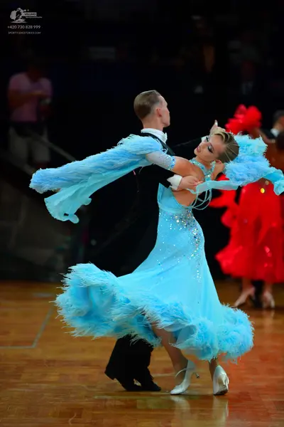 Dancesport competitor: Male dancer: black suit with a white shirt