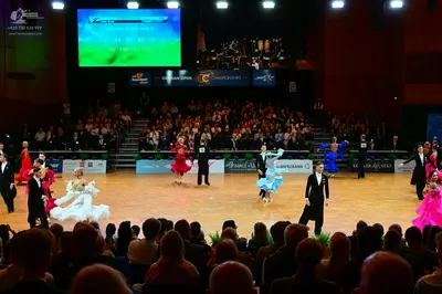 Dancesport competitor: Male dancers: black suits with white shirts and black trousers