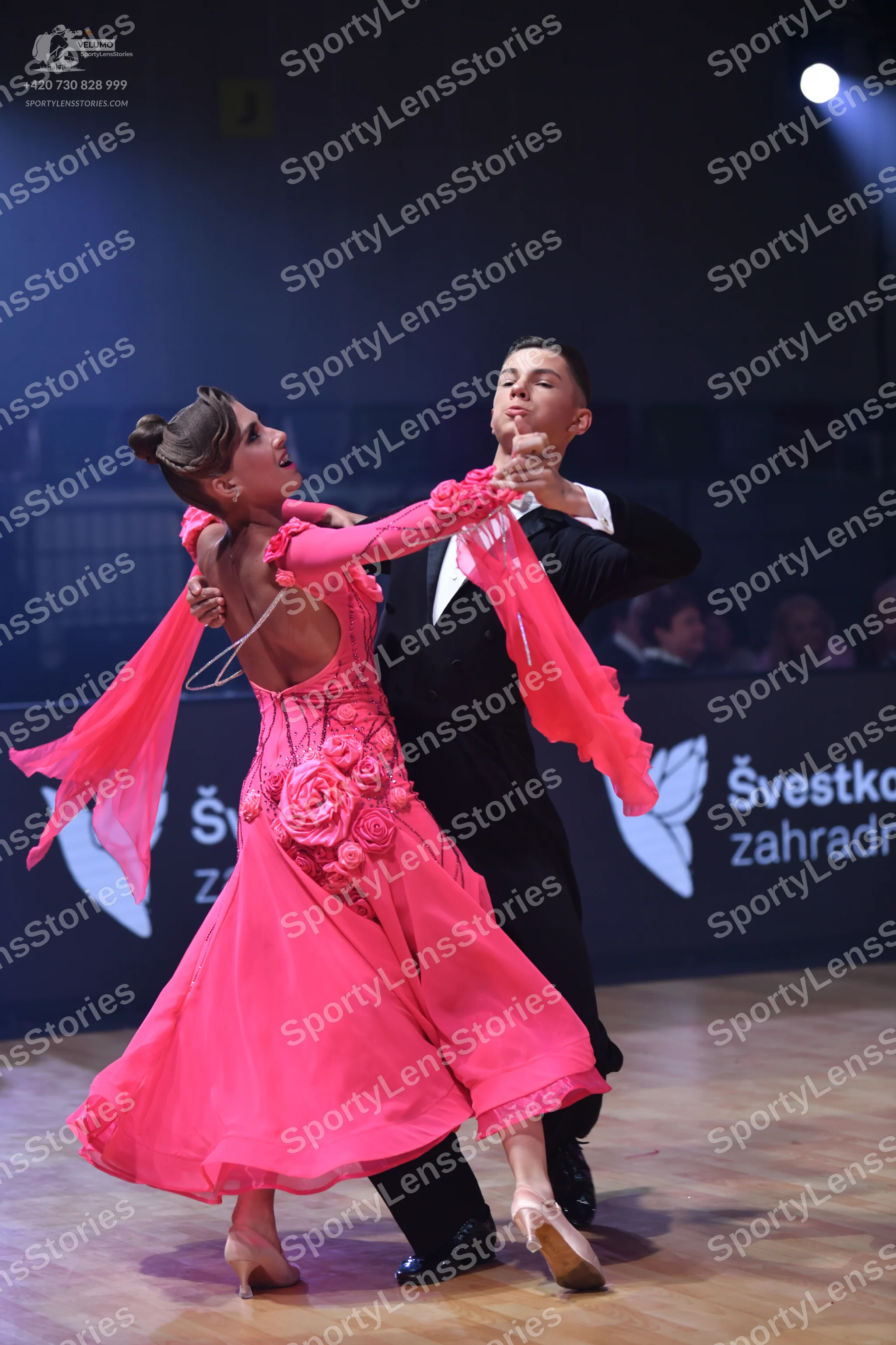 Dancesport competitor: Male dancer: black suit with a white shirt and black bow tie