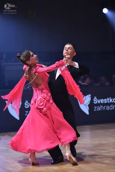 Dancesport competitor: Male dancer: black suit with a white shirt and black bow tie