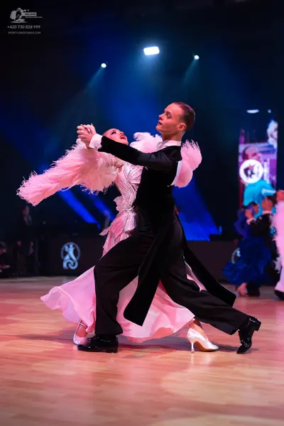 Dancesport competitor: Male dancer: black tailcoat