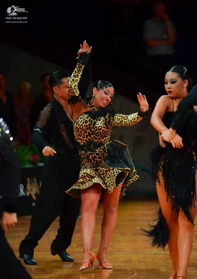 Dancesport competitor: Male dancer: black shirt with shimmering details and black trousers