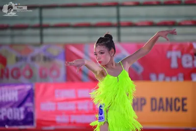 Dancesport competitor: ** Yellow Latin Dress
*   **Color:** Bright, vibrant yellow
*   **Fabric:** Appe