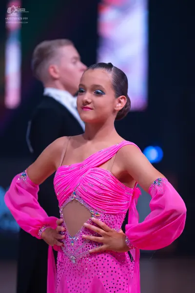 Dancesport competitor: Male dancer: black suit with a white shirt