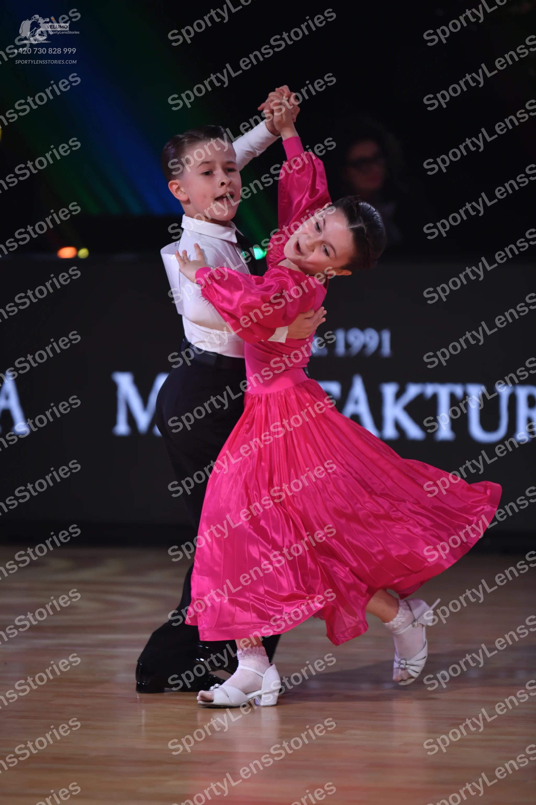 Dancesport competitor: Male dancer: white long-sleeved shirt and black trousers