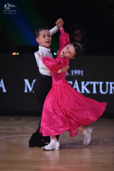 Dancesport competitor: Male dancer: white long-sleeved shirt and black trousers