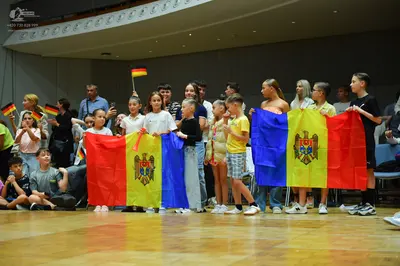 Dancesport competitor: The individuals in the foreground are wearing casual clothing rather than compet
