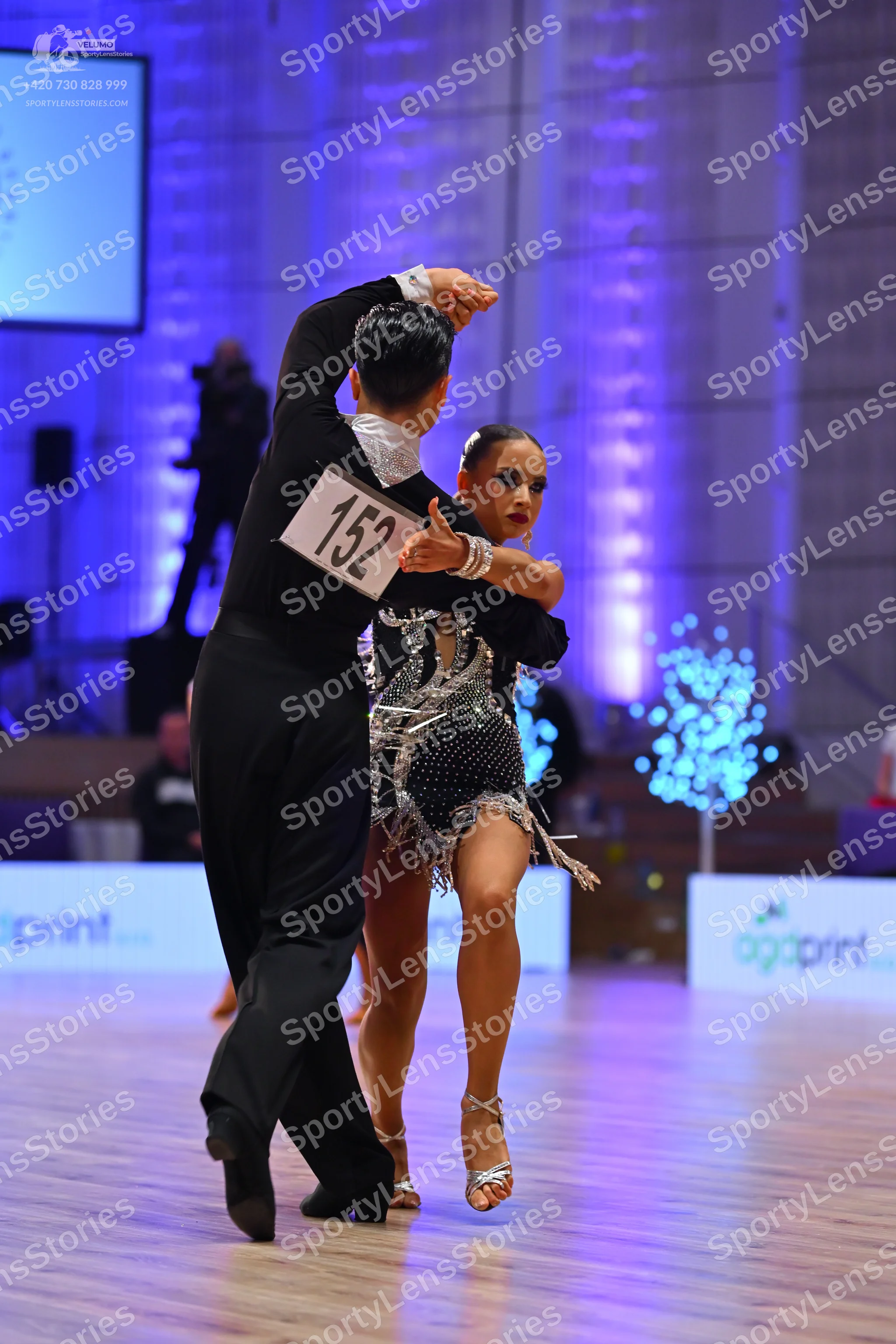 Dancesport competitor: Male dancer: black suit with a white collar