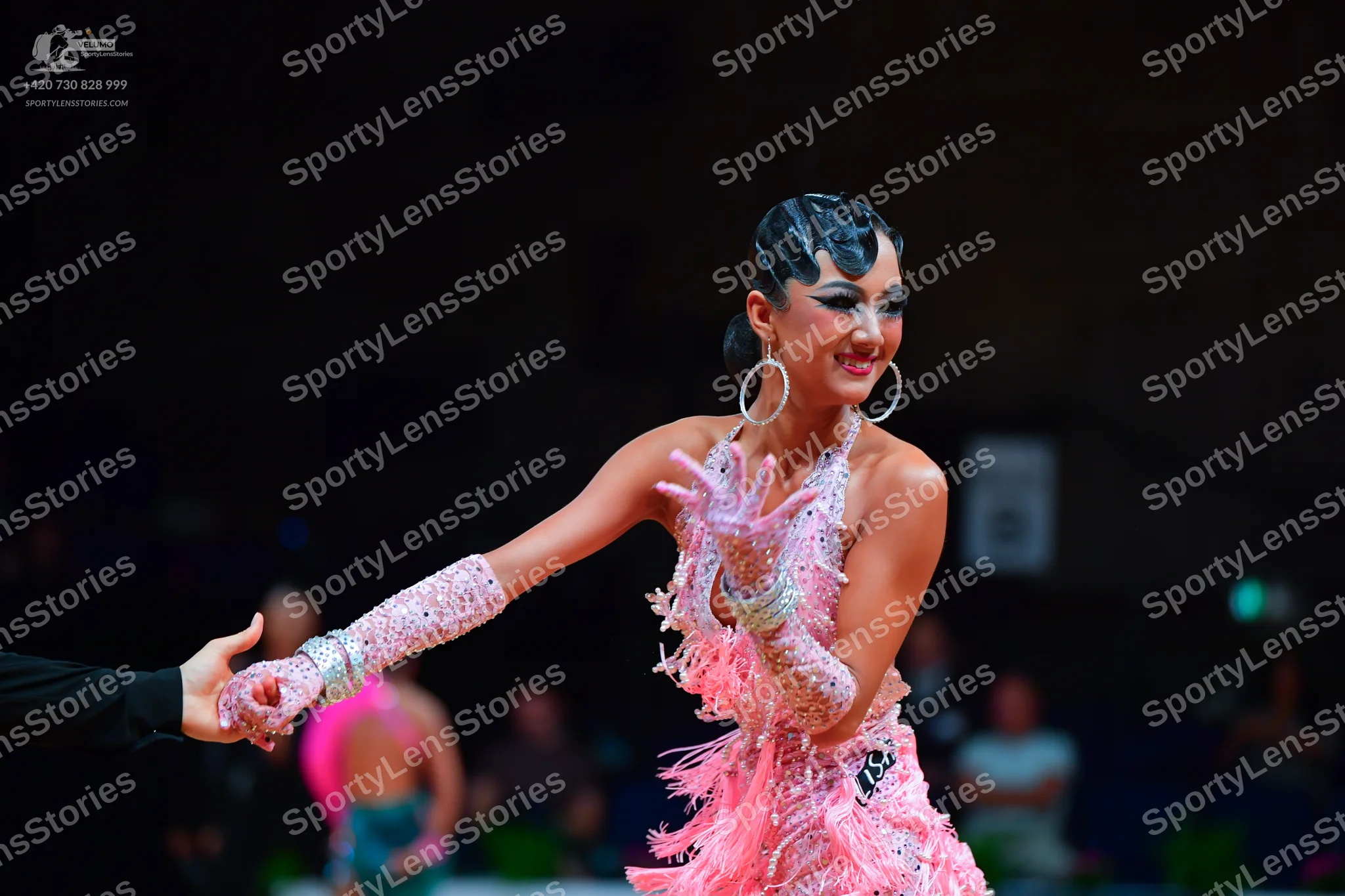 Dancesport competitor: Main female dancer: light pink/lavender latin dress with heavy sequin/crystal em