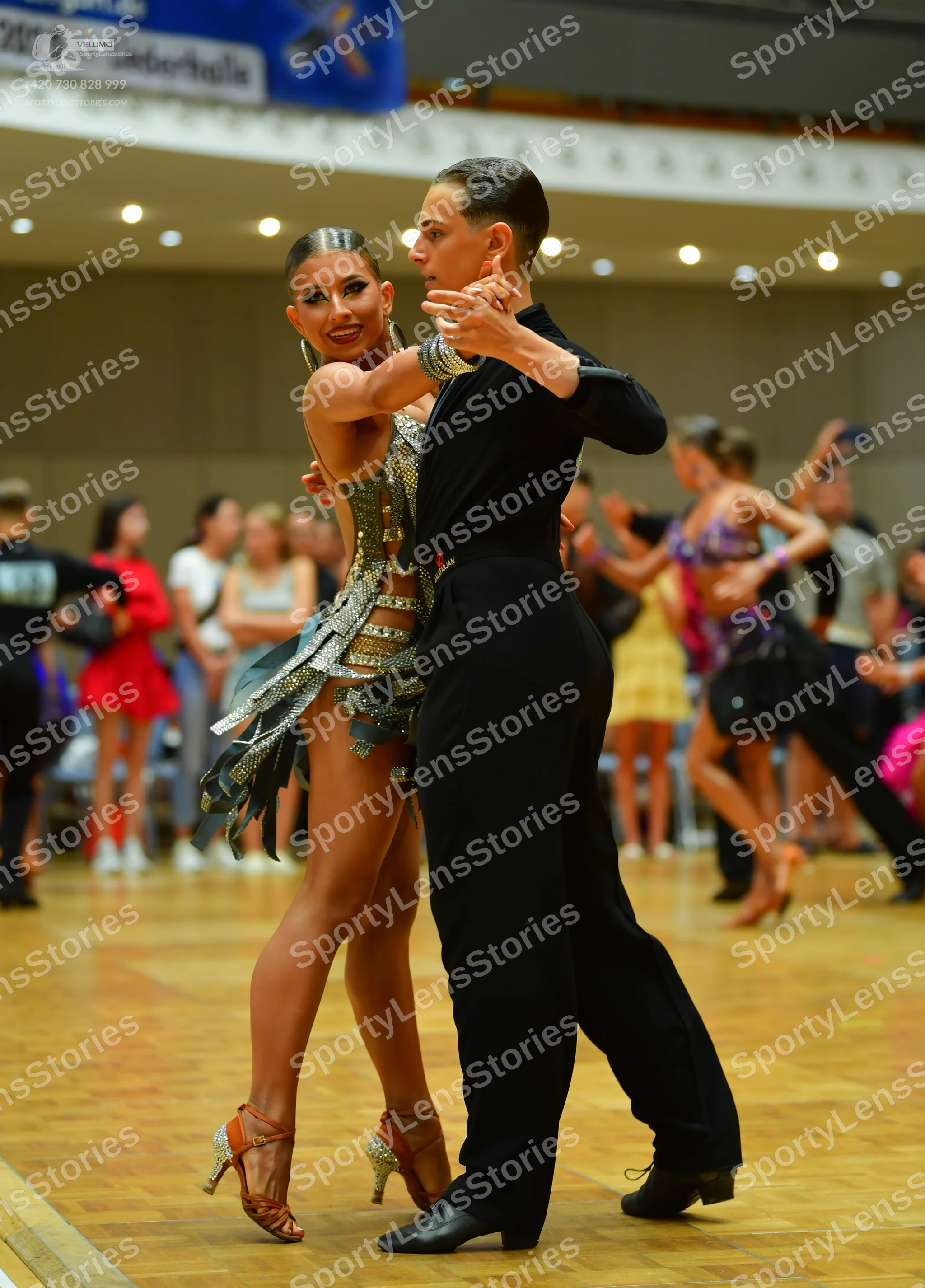 Dancesport competitor: Male dancer: black long-sleeved shirt and black trousers