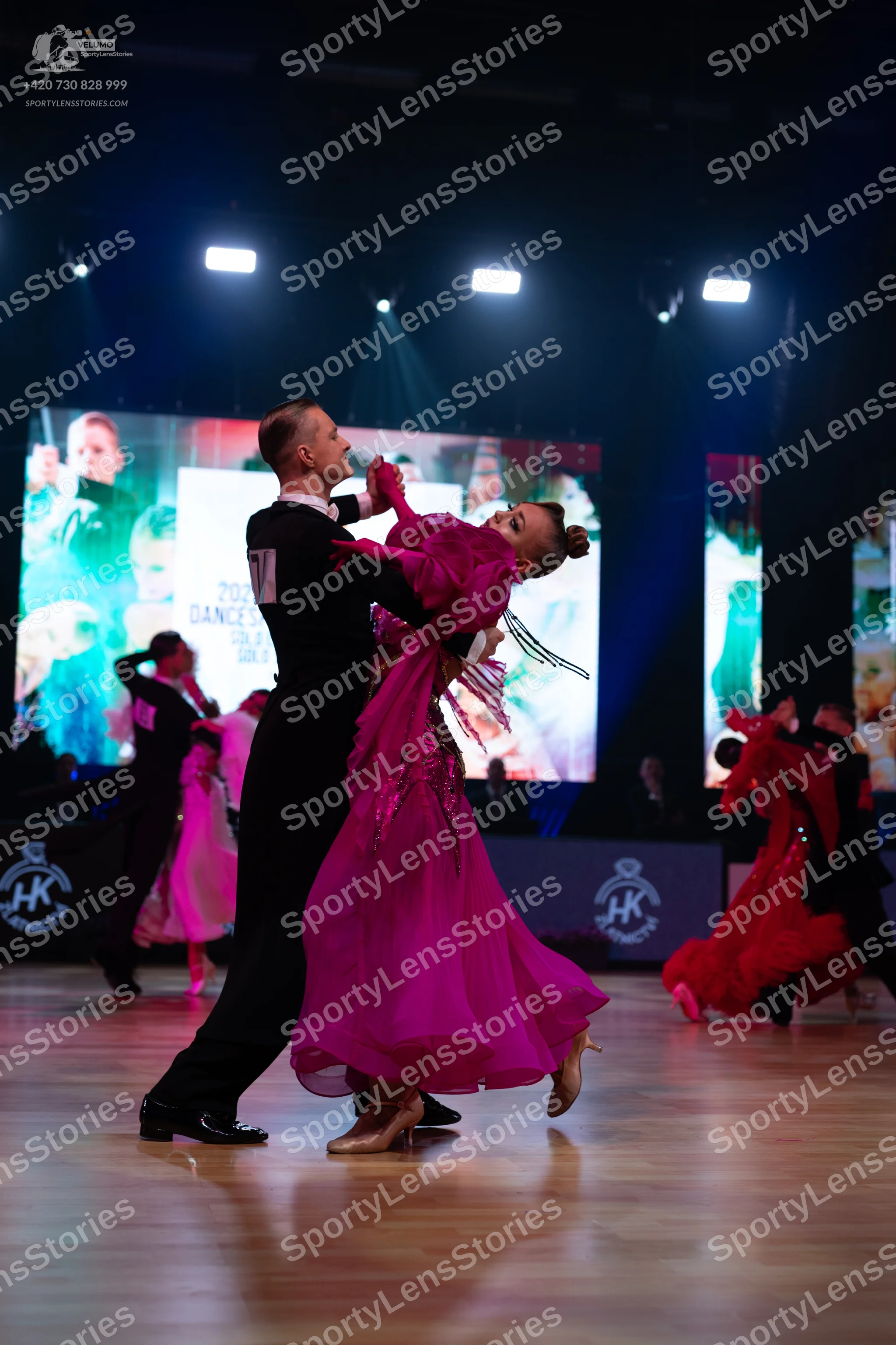 Dancesport competitor: Main male dancer: black suit, white shirt, and black bowtie