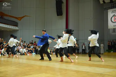 Dancesport competitor: Female dancers: white long-sleeved shirts and black leggings