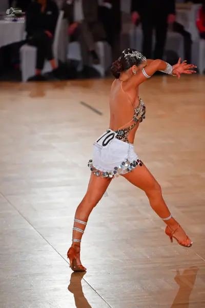Dancesport competitor #70: Female dancer: white Latin dance costume with a bodice heavily embellished with 