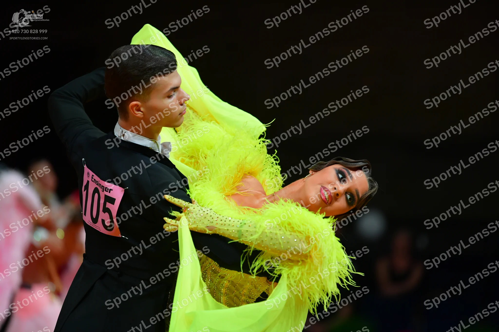 Dancesport competitor: Male dancer: black suit with a white shirt and a white bow tie