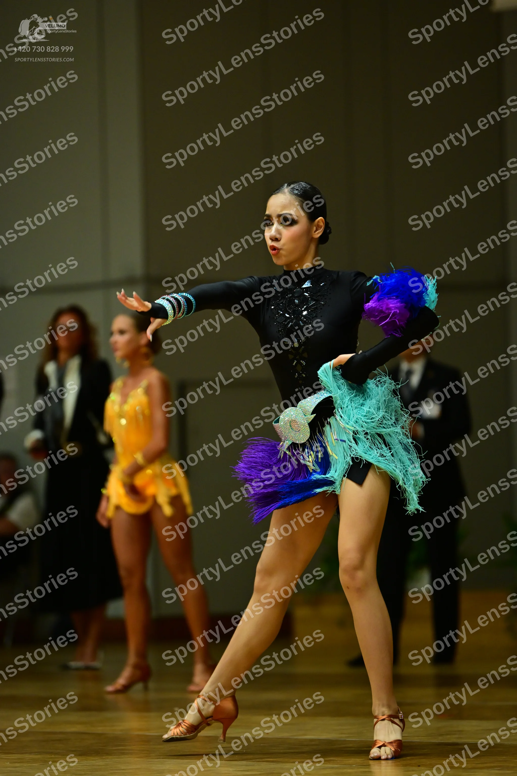 Dancesport competitor: Main dancer: black long-sleeved Latin dress with silver sequins on the bodice an
