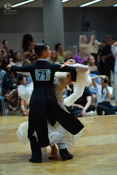 Dancesport competitor #71: Male dancer: black ballroom suit