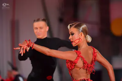 Dancesport competitor: Male dancer: black long-sleeved high-neck top