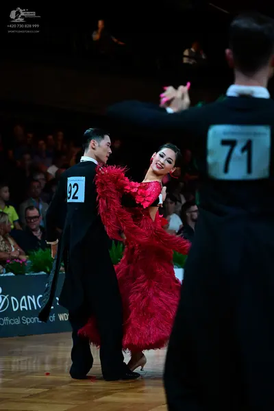 Dancesport competitor #71, #92: Male dancers: black suits