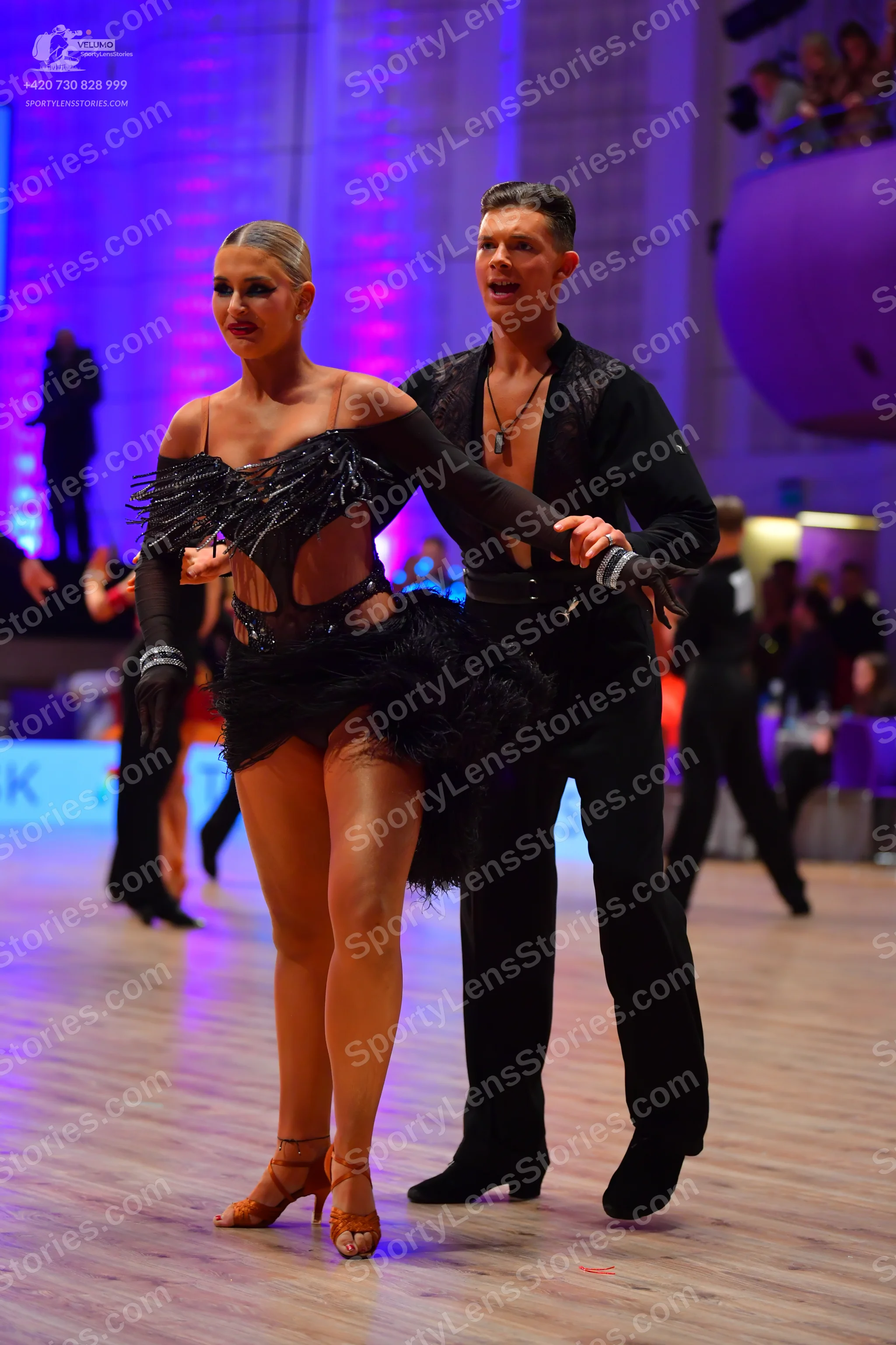 Dancesport competitor: Male dancer: black long-sleeved dance shirt and black trousers with a black neck
