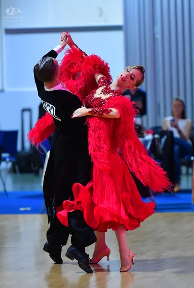 Dancesport competitor #27: Male dancer: black long-sleeved shirt and black trousers