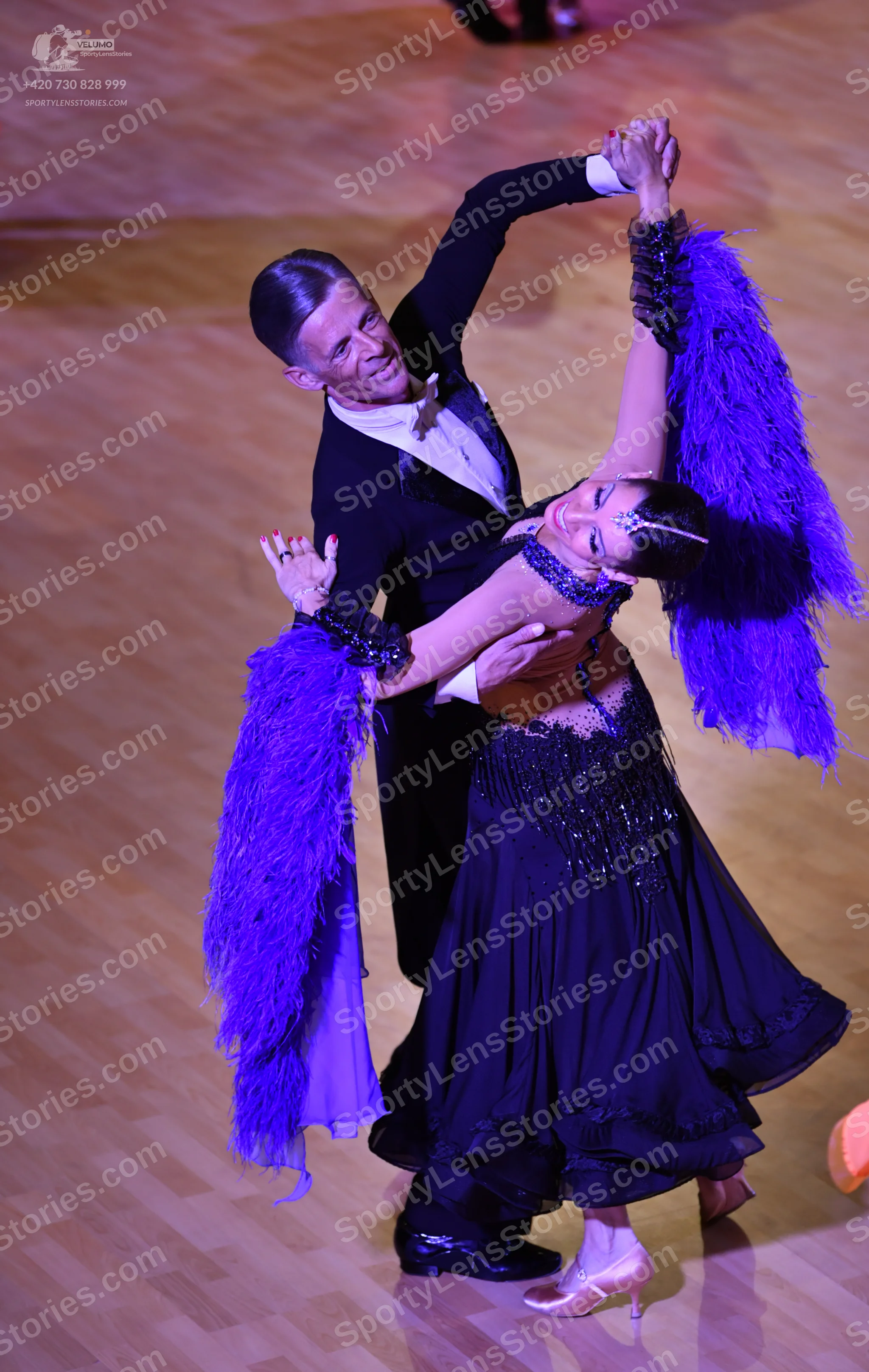 Dancesport competitor: ** Male: Black tailsuit with sequin lapels and a black sash