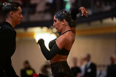 Dancesport competitor: Male dancer: black long-sleeved shirt