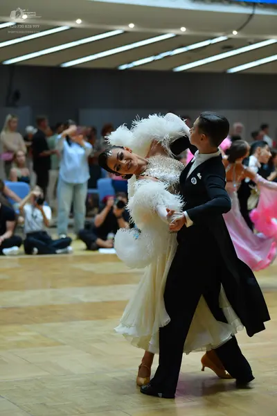 Dancesport competitor: Male dancer: black tailcoat with a white shirt and black bowtie