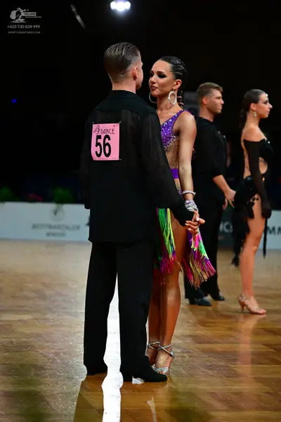 Dancesport competitor #56: Male dancer 1: black long-sleeved shirt and black trousers