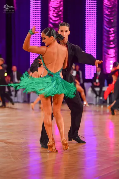 Dancesport competitor: Male dancer: black long-sleeved shirt and black trousers