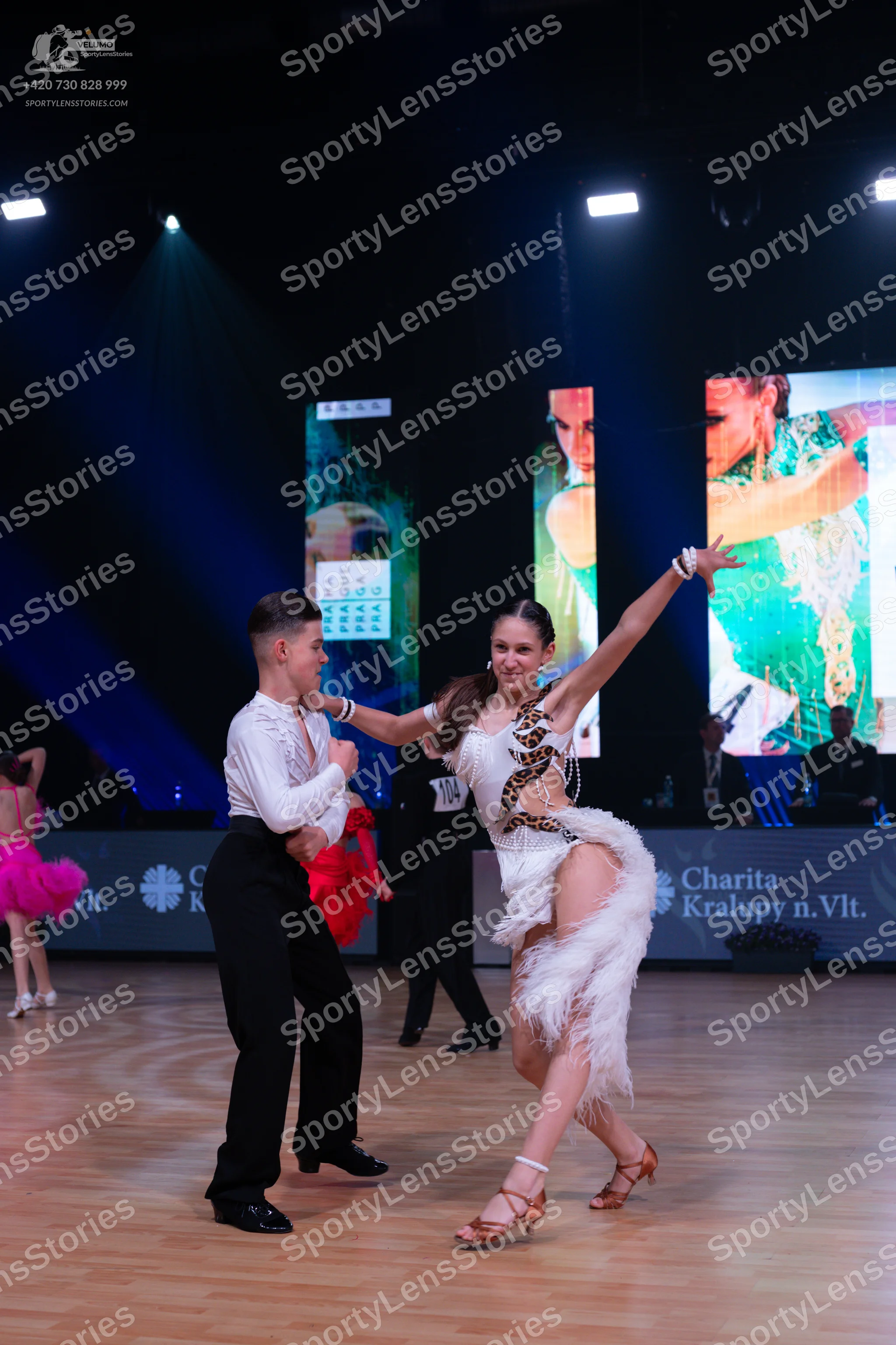 Dancesport competitor: Male dancer: white long-sleeved shirt and black trousers