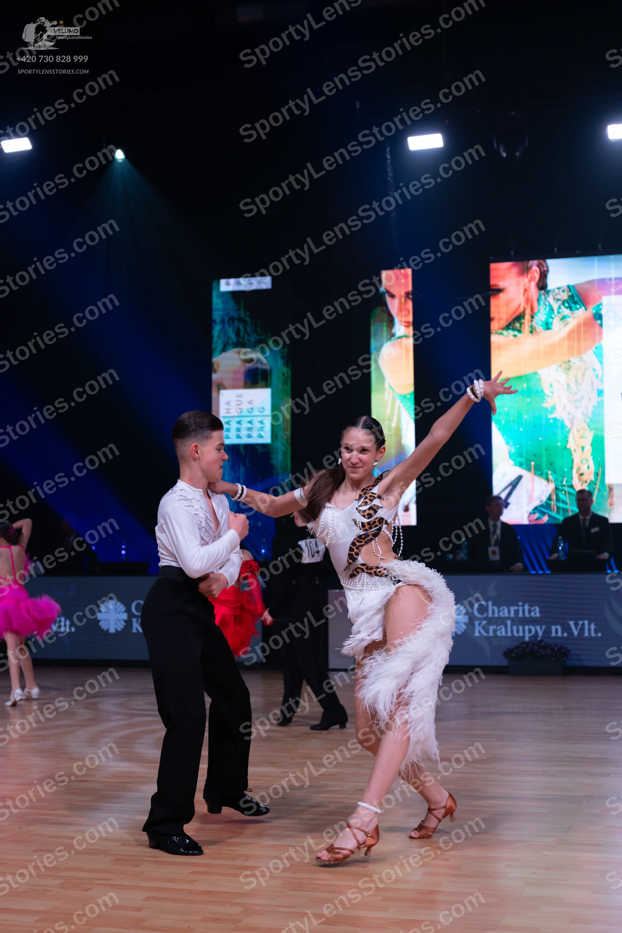 Dancesport competitor: Male dancer: white long-sleeved shirt and black trousers