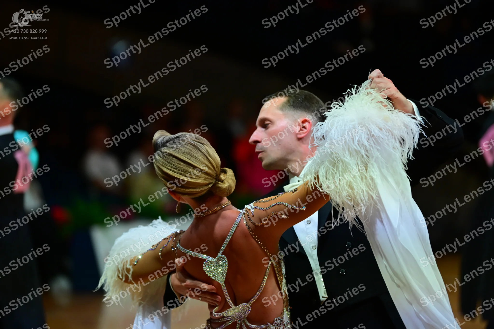 Dancesport competitor: Male dancer: black ballroom suit with a white shirt